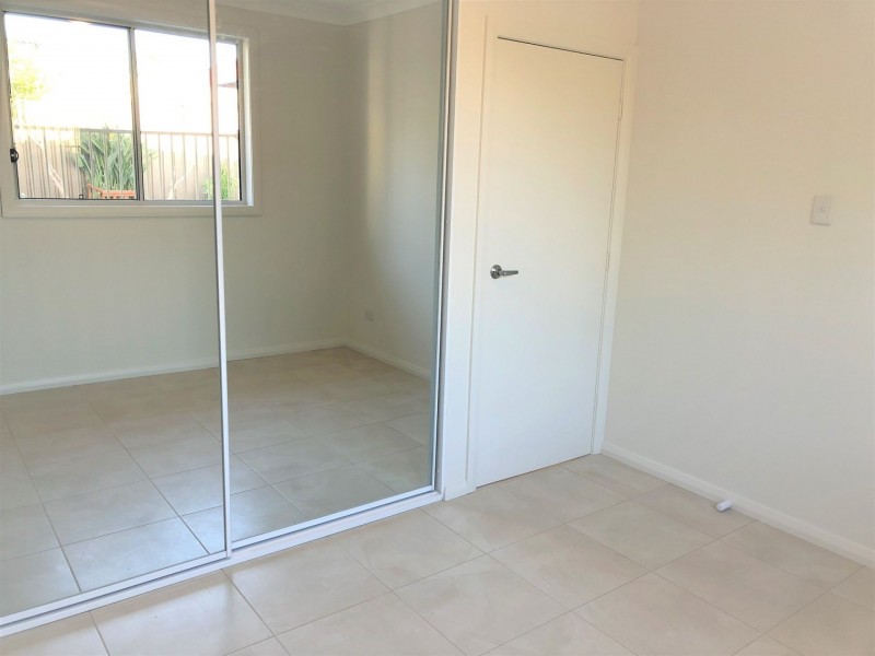 34 Owen Stanley Rd, Glenfield NSW 2167