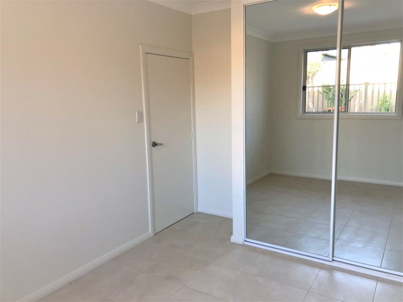 34 Owen Stanley Rd, Glenfield NSW 2167