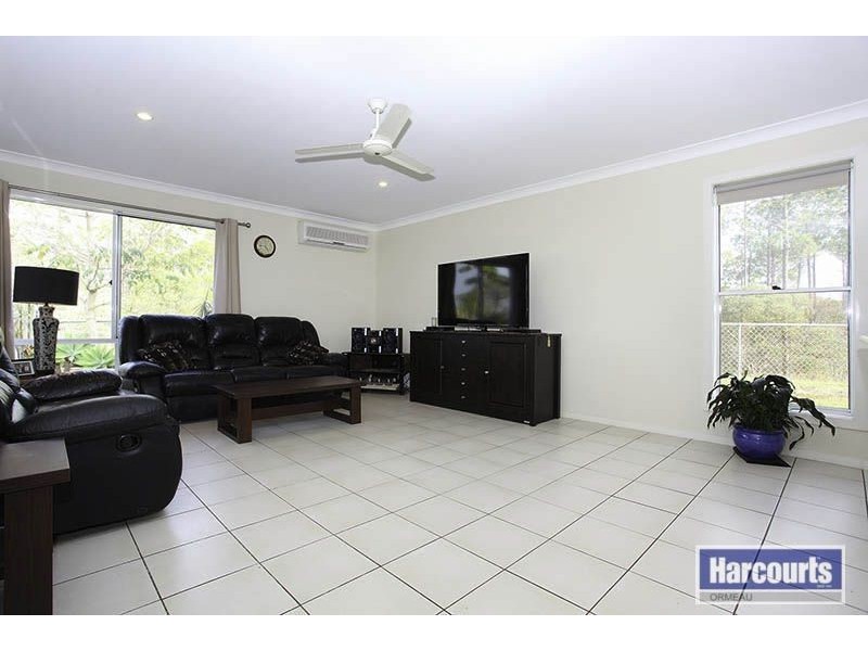 12 Norfolk Drive, Pacific Pines QLD 4211