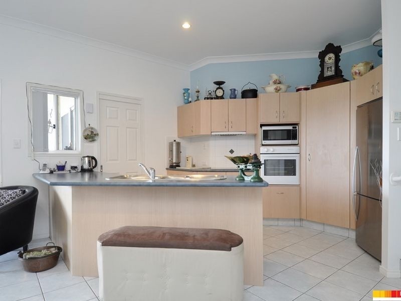 24 Manra Way, Pacific Pines QLD 4211