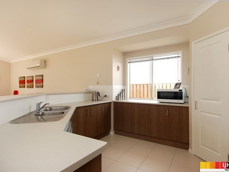 52 Harmsworth Road, Pacific Pines QLD 4211