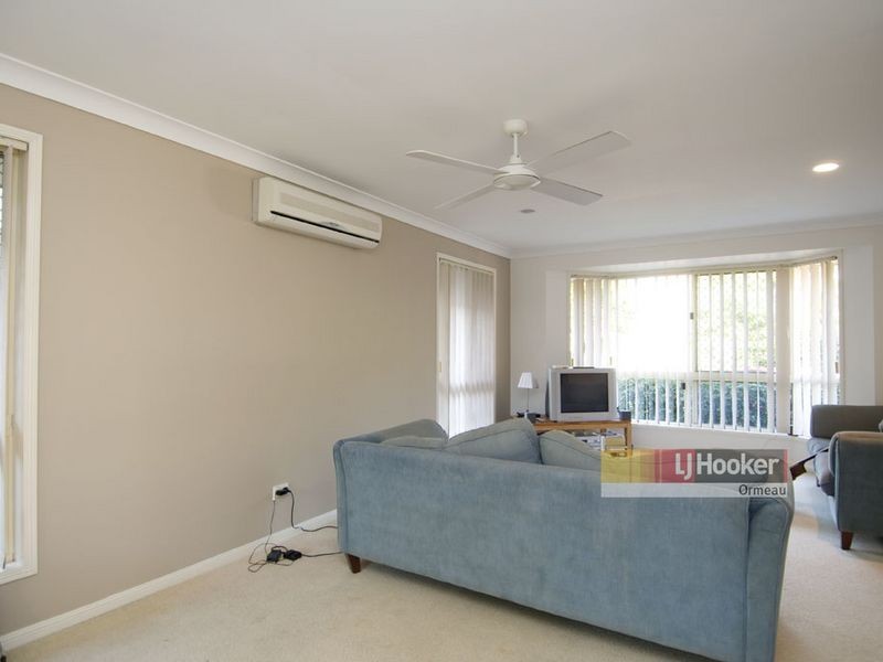 8 Whitecap Cl, Pacific Pines QLD 4211
