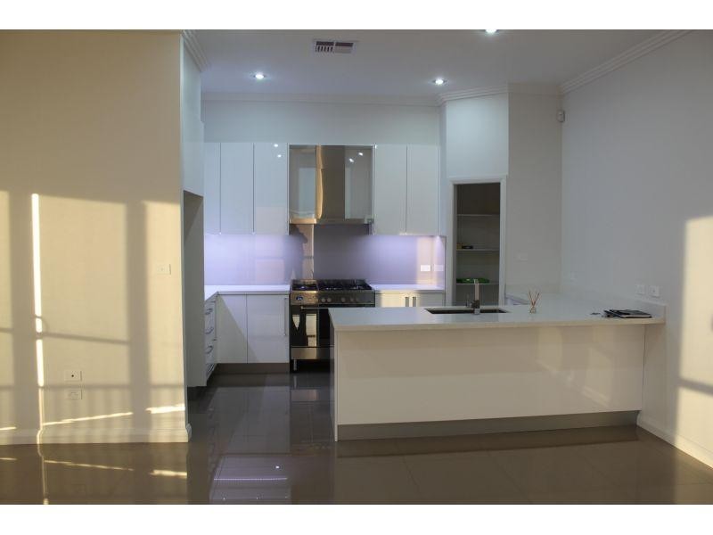 64 Whimbrel Avenue, Lake Heights NSW 2502